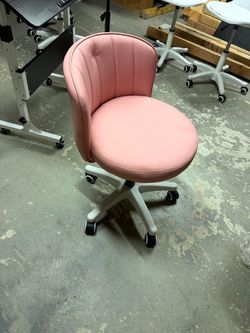 Pink faux leather rolling office chair