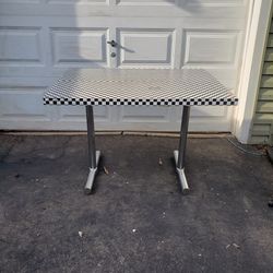 Sturdy compact kitchen table covered in contact paper checkerboard