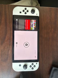 Hardly used white switch with case and docking station