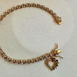 Vintage 925 sterling silver gold cubic zirconia tennis rhinestone bracelet with heart shaped charm  Approx 7.75” length  In great condition