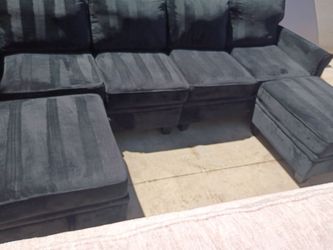 Reversible sectional couch with storage in ottoman