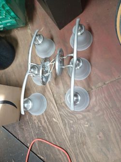 Glass vanity light fixtures