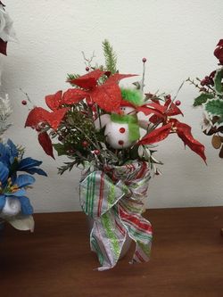 Snowman arrangement in a silver pot
