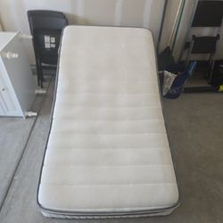 Basically brand new twin mattress.  Memory foam/spring hybrid.