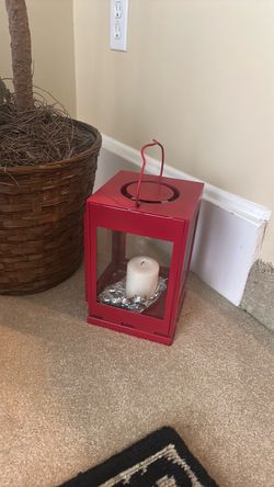 Ornamental red lantern with candle
