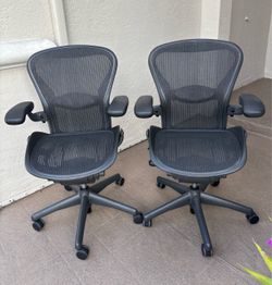 Two Herman Miller Aeron office chairs