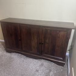 Wooden Cabinet With Three Doors And Two Shelves