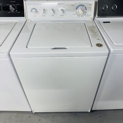 KitchenAid white washing machine, includes a receipt with a 60-day warranty.