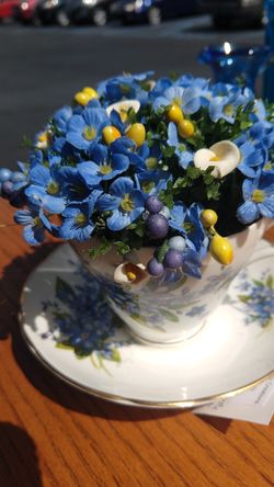 Vintage tea cup floral arrangement