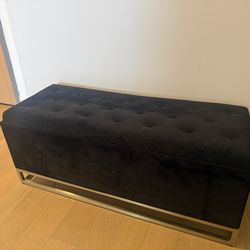 Black velvet and gold storage bench