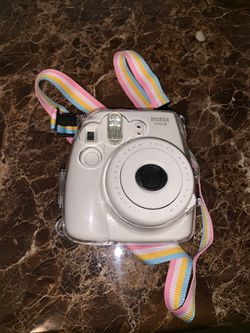 Instax Mini 8 with clear case and strap