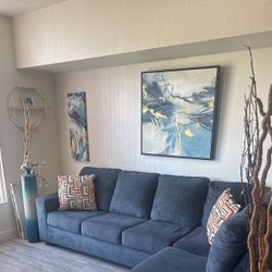 Blue Sectional Couch, 2 Vase, Pictures, and stands. 2 Bar Stools