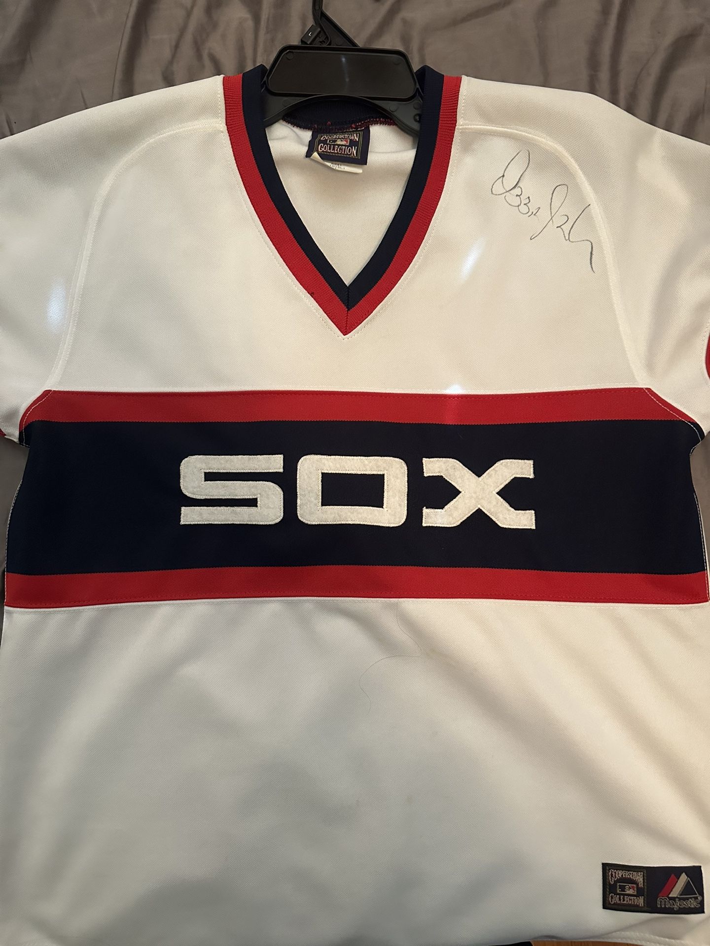 Signed Ozzie Guillen Jersey.