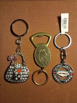 Very nice key chains new , purse pre owned...