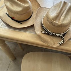 Two straw cowboy hats