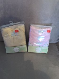 Two packs of 6-9 month onesies NEW