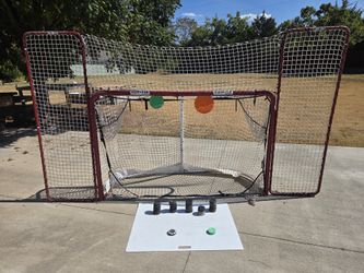 Hockey Net with pucks targets and small shooting pad
