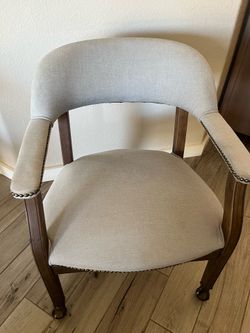 Office desk chair on rollers.