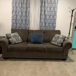 grey studded couch 