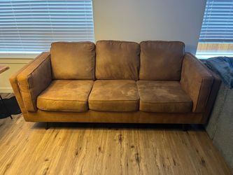 2 Brown 3 seat sofas