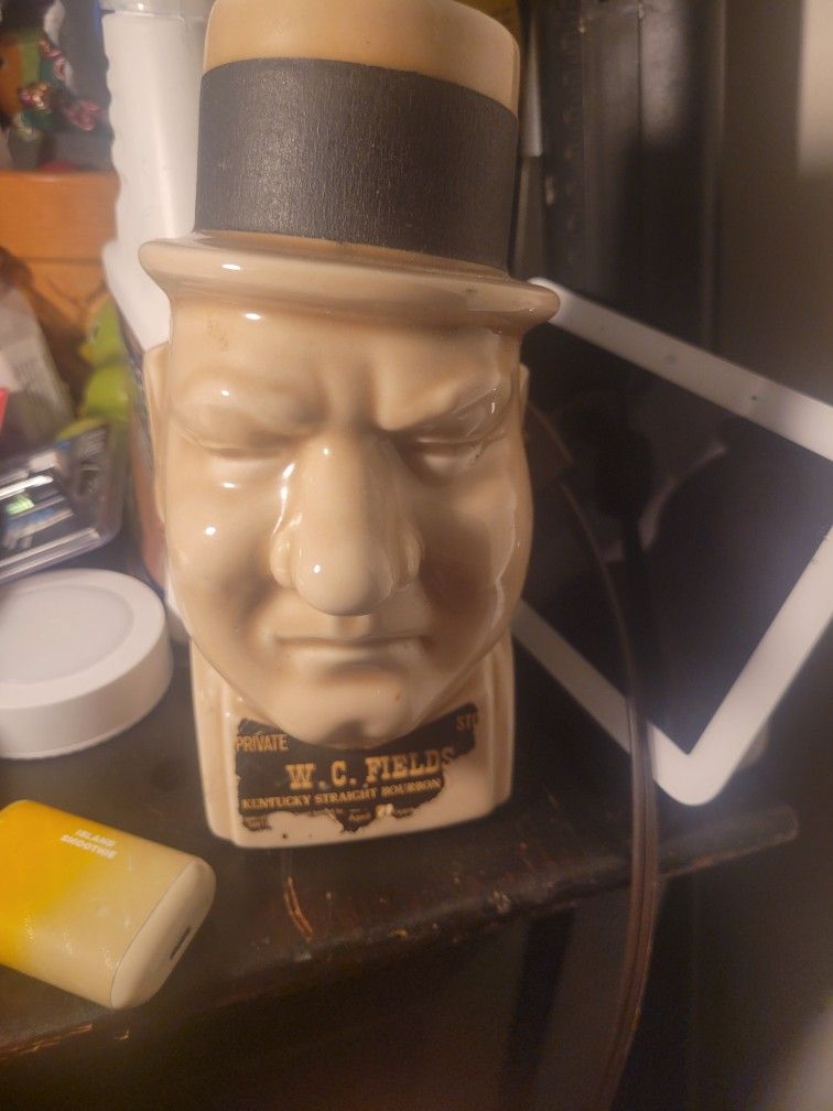 This vintage W.C. Fields Kentucky Straight Bourbon Whiskey decanter is a collectible item.