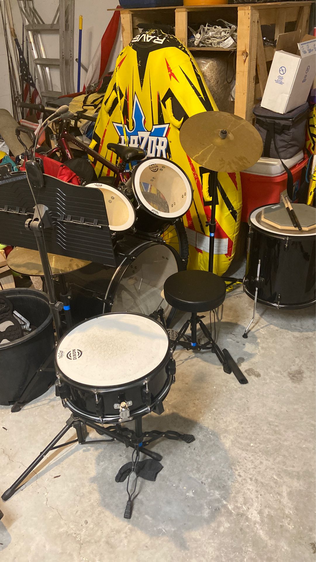 Drum set with music stand, sticks and a practice pad