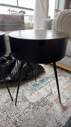 Two black metal tables