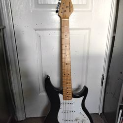 Behringer black electric guitar