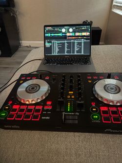 MacBook and DJ mixer