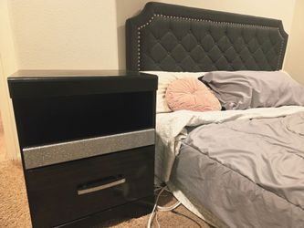 Cal king bed frame with dresser chest and matching nighstand.