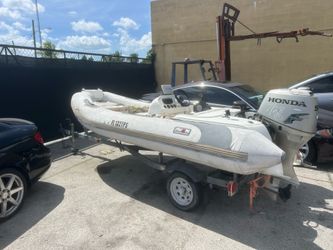 Avon zodiac inflatable council boat with Honda. Engine needs some work missing some parts comes with trailer.