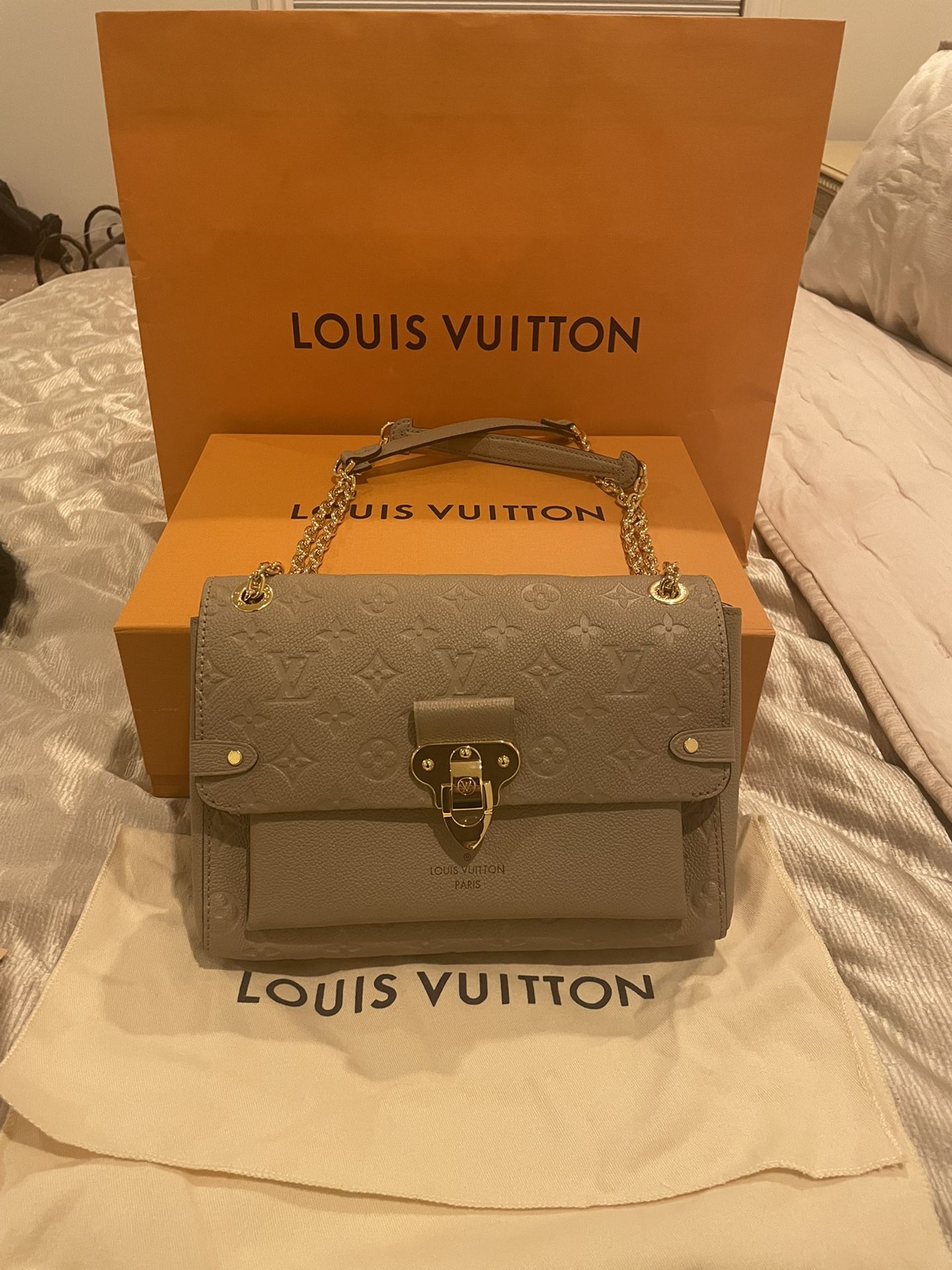 LV Vavin Chain Wallet Beige WOC Leather, Women's Fashion, Bags & Wallets,  Clutches on Carousell