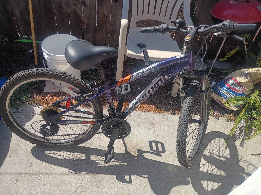 The Schwinn Ranger 24" Mountain Bike is a bike with a lightweight aluminum frame, front suspension fork, and 24 by 2.4-inch tires. It has 21-speed twi