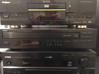 Yamaha Polk Audio surround sound (5channel) system. Receiver, 5 disc CD changer, DVD, tower speaker, center channel speaker, and rear surround speake