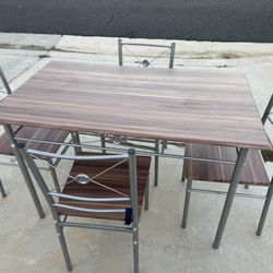 Dinning Table And Four Chairs
