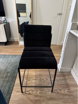 A pair of CB2 bar stools