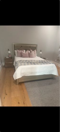 Queen sized bed with mattress and night stands