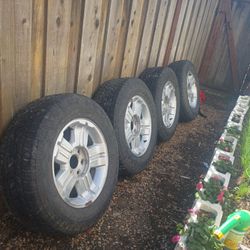 A Set Of Four Like New Chrome Wheels With Tires Size P265/65r18.