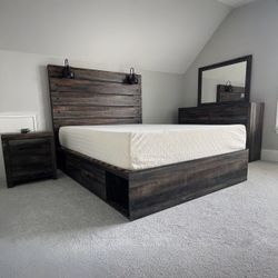 Drystan Multi Double Side Storage Platform Bedroom Set
Queen Bed, Dresser, Mirror, Nightstand