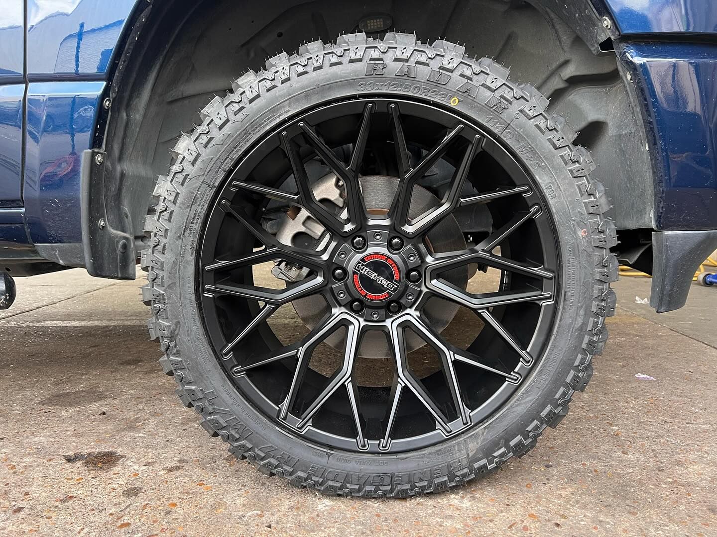 22X10 GLOSS BLACK OFFROAD RIMS WITH 33125022 TIRES 