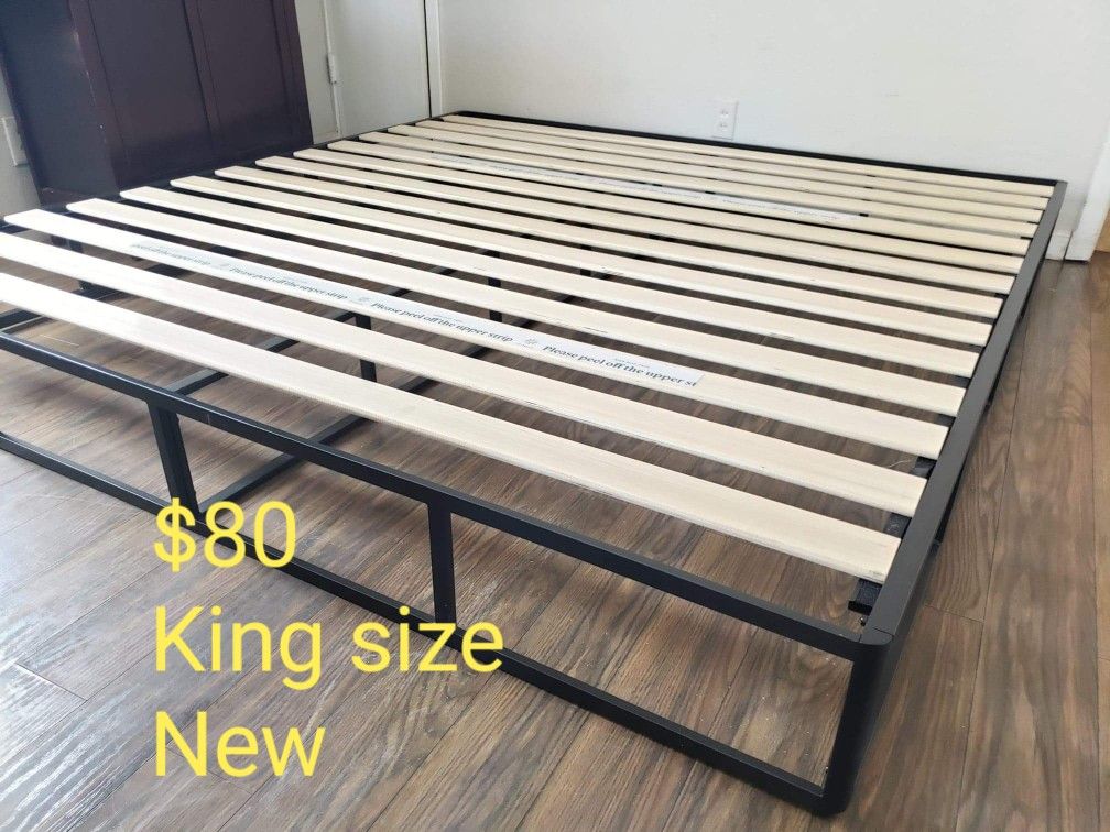 Platform bed frame king size. Brand new. Free delivery. $80