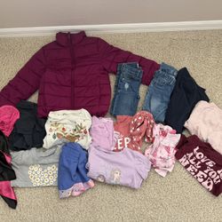 Girls clothing lot, size 5-7/8.  Pajamas, winter coat, tops, jeans, skirt, leggings, and one dress up costume. Pet and smoke free home. 16 items.