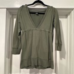 Green long sleeve shirt with V-neckline and hood