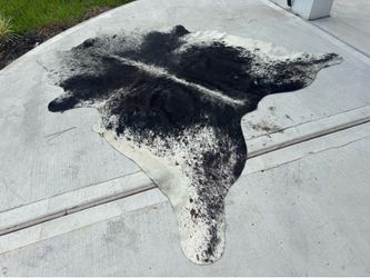 large black-and-white cow skin rug