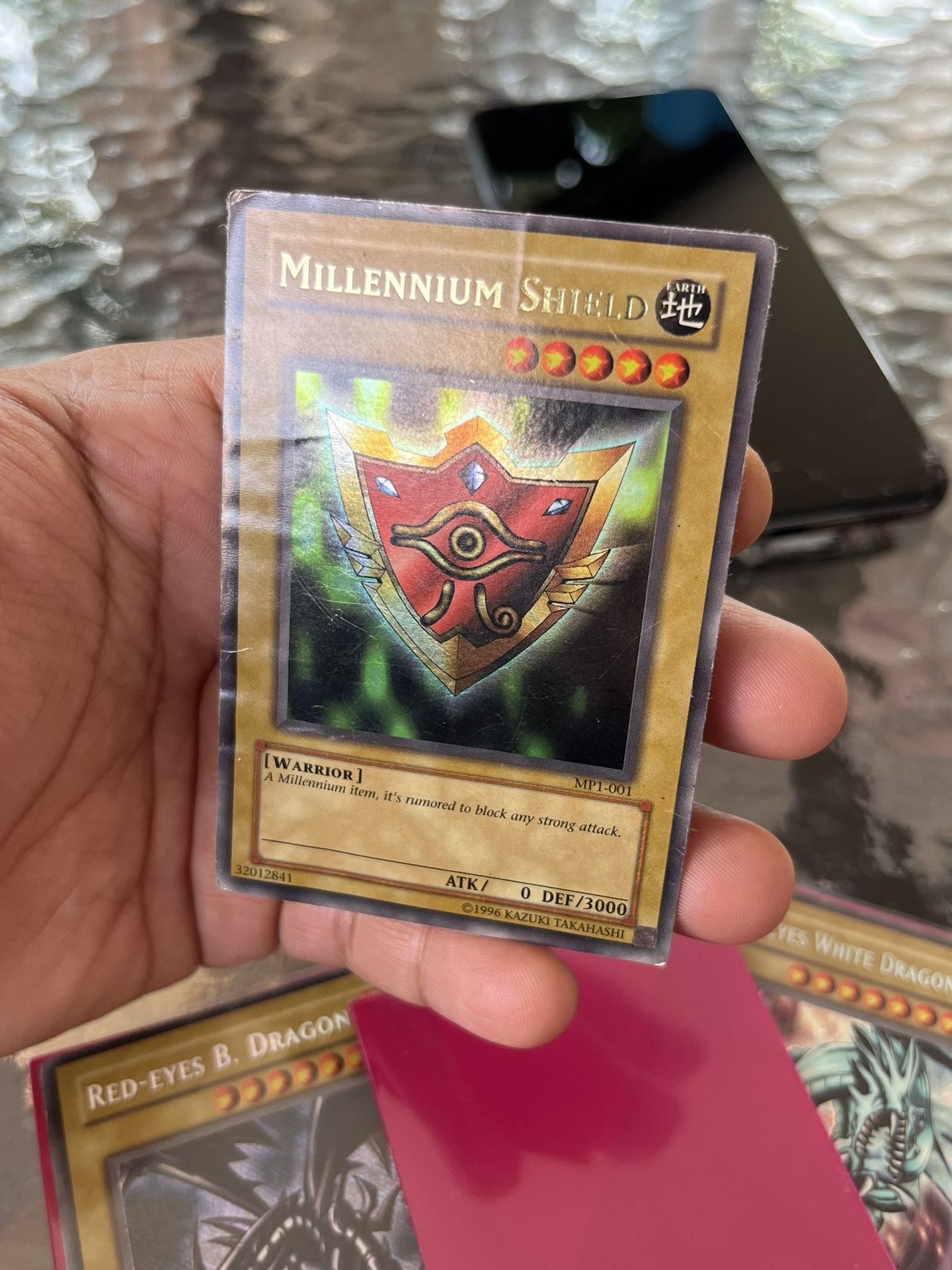 YuGiOh Millennium Shield - Ultra Rare - MP1-001 heavy play must see HOLO  vintage for Sale in Miami, FL - OfferUp