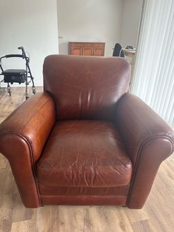 Brown leather arm chair & ottoman
