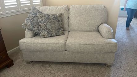 2 cushion couch with pillows