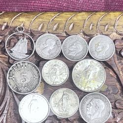 Eight silver world, coins, and one silver pendant