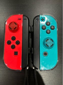 Nintendo Switch Joy-Cons - Neon Red & Neon Blue w/ Guards, Thumb Grips, & Straps