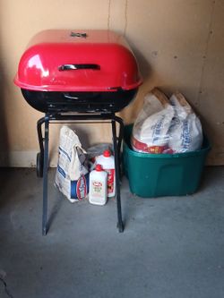 Outdoor grill w/ charcoal and lighter fluid